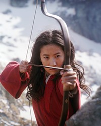 FEMALE POWER Standing in for her father, Hua Mulan (Yifei Liu) impersonates a male to fight in the Imperial Army against Bori Khan and his warriors in the Disney live-action remake of Mulan.