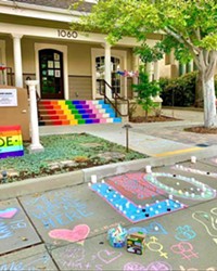 COMMUNITY SUPPORT A student organized vigil left chalk art to support the GALA Pride and Diversity Center after its sign was vandalized.