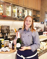 SAY CHEESE Sommelier Jenna Isaacs can help guests assemble luxury gift baskets featuring a cornucopia of house-made, local, and imported items, including dozens of cheeses and more than 2,000 wines from around the world.