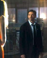 SCI-FI SLEUTH After the woman he loves goes missing, Nick Bannister (Hugh Jackman) begins revisiting his own memories over and over in an attempt to find clues and track her whereabouts, in Reminiscence.