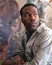 MENACING MUSE Chicago-based artist Anthony McCoy (Yahya Abdul-Mateen II) decides to base his next exhibition on a horrific urban legend he's become engrossed in, in director Nia DaCosta's Candyman.