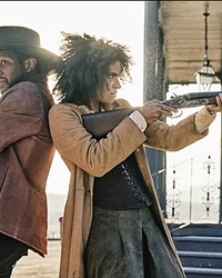 HISTORICAL FANTASTICAL Nat Love (Jonathan Majors) and Stagecoach Mary Fields (Zazie Beetz) shoot it out with a rival gang, in The Harder They Fall, a revisionist Black Western streaming on Netflix.