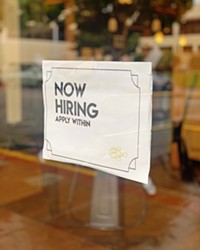 STAFFING STRUGGLES SLO County's unemployment rate hit an all-time pandemic low, but the economy is still struggling in other ways. Plenty of downtown SLO businesses have "now hiring" signs, like this one at Shin's Sushi on Monterey Street, in their windows.