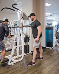 GET FIT Brian Peffly (left) works with trainer John Hornbuckle at Kennedy Club Fitness in SLO. Kennedy won Best Health Club/Gym in this year's annual readers poll.