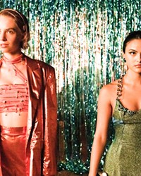 FRIENDS IN NEED Thanks to bullying meanies, Eleonor (Maya Hawke, left) and Drea (Camila Mendes) find their high school lives in shatters, so they make a pact to go after each other’s bullies in Do Revenge, on Netflix.