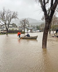 FLOATING ON Residents of SLO’s Laguna Lake neighborhood resorted to row boats for transportation after the Jan. 9 storm flooded its streets.