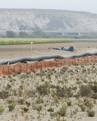 THAT&rsquo;S A BIG PIPE:  The steel-cased pipeline was welded and pressure tested prior to being dragged through the hole under the riverbed.