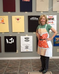 QUEEN TEE :  Owner Joanne Limberg displays her art in SLOs mock-gallery T-shirt shop.