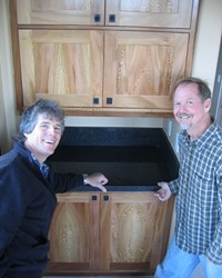 NATURES ART :  Locally grown sycamore, a relative of maple, was used by cabinetmaker Clark Kluver (right) for the cabinets in the Arroyo Grande home of Mike Geringer (left).
