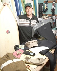 CHANGING THE WORLD :  Ryan Milliman hopes that the Earth-friendly boards and more that he offers through the Shell Beach Surf Shop and the online Seahuggers will push the industry toward preserving the ocean.
