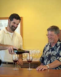 POUR GUYS  :  John Stipicevich (left) and Doug Shaw (right) opened a wine store with a chummy setting and daily tastings, which make for a fun and relaxed atmosphere.
