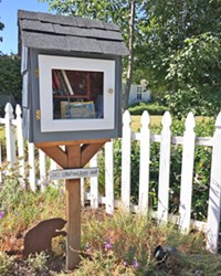 SHARING With the help of a neighbor, Angela Stoll created a space where her neighbors could share their love of books.