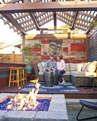 PERFECT GETAWAY Because their Shell Beach home is small, Kevin and Susan Bratcher spread out in all directions, creating an Asian pergola in the backyard that doubles as a stage for house concerts.