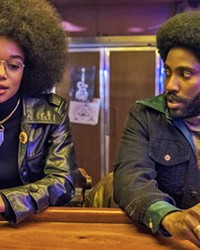 BLACK IS BEAUTIFUL Patrice Dumas (Laura Harrier) and Ron Stallworth (John David Washington) bond after attending a talk by former Black Panther Kwame Ture.