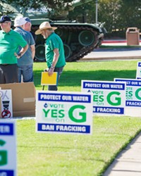WATER ADVOCATES Supporters of Measure G, the ballot initiative to ban new oil and gas drilling in SLO County, held a rally before an EPA town hall meeting in the SLO Vets’ Hall on Aug. 23.