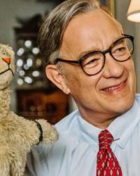 PUPPET MASTER Tom Hanks plays beloved television host Fred Rogers, in director Marielle Heller's biopic, A Beautiful Day in the Neighborhood.