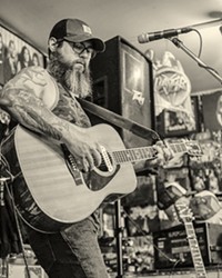 SOUL BARE Jon Bartel, pictured here at a solo show he played at The Heavy Metal Shop in Salt Lake City last summer, recently released a forlorn and potent new EP, Hell.