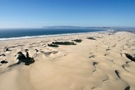 UP IN THE AIR:  Off-road vehicles at Oceano are polluting the air around Nipomo Mesa with sand and dust particles. But what can be done? - PHOTO BY STEVE E. MILLER