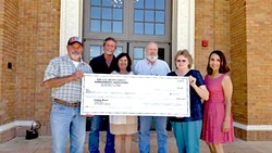 PHOTO COURTESY OF DEBBIE ARNOLD - GIVING The Garbagemen's Association and 5th District Supervisor Debbie Arnold present the Atascadero Historical Society a donation to continue its efforts of running a museum and preserving the history of the city.